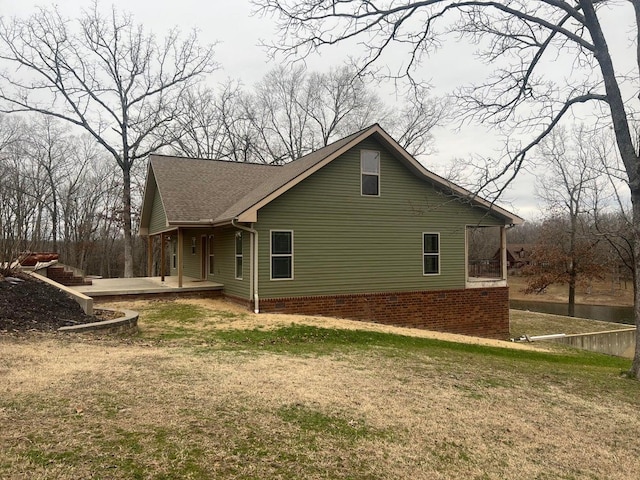 view of home's exterior featuring a lawn