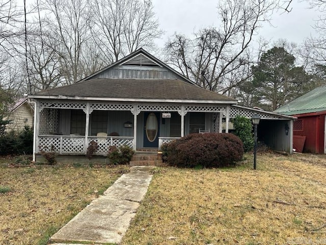 bungalow featuring a front yard and covered porch