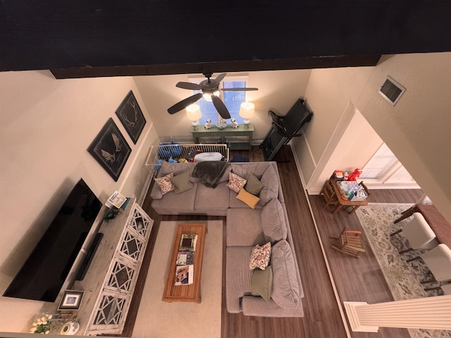 living room with wood-type flooring and ceiling fan