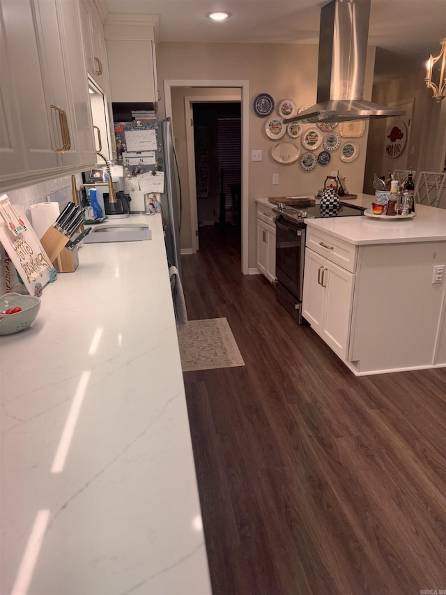 kitchen featuring black electric range oven, white cabinetry, dark hardwood / wood-style floors, light stone countertops, and island exhaust hood