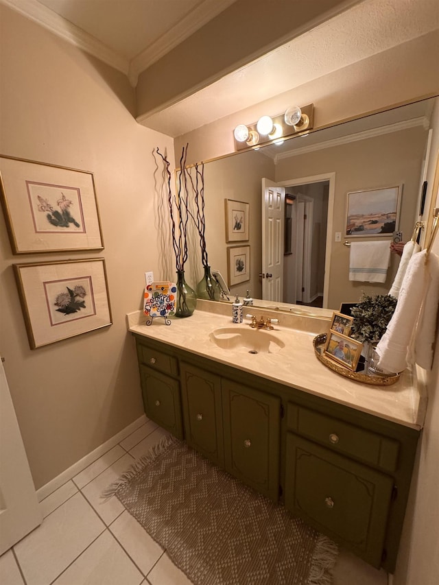 bathroom with crown molding, vanity, and tile patterned flooring