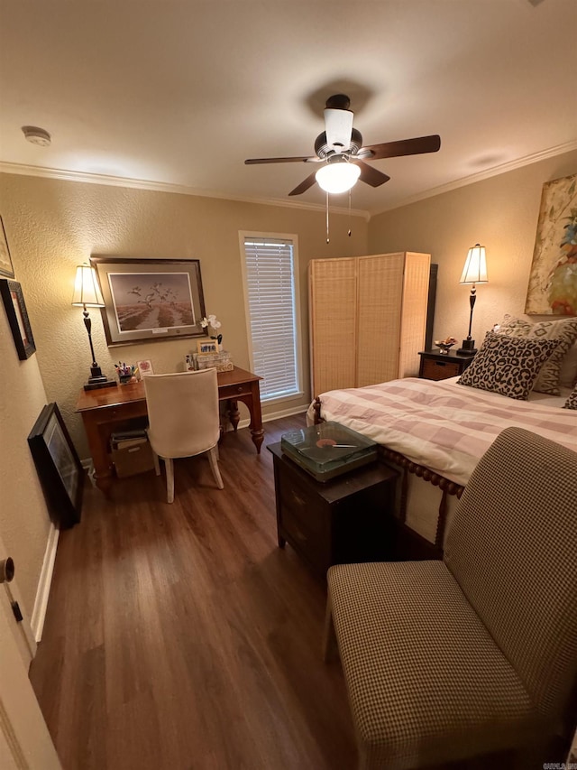 bedroom with crown molding, dark wood-type flooring, and ceiling fan