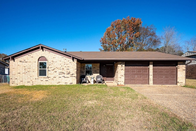 ranch-style house with a garage and a front lawn