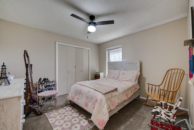 carpeted bedroom with ceiling fan, a closet, and a textured ceiling