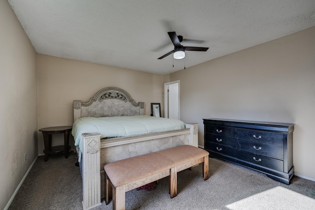 carpeted bedroom with a textured ceiling and ceiling fan