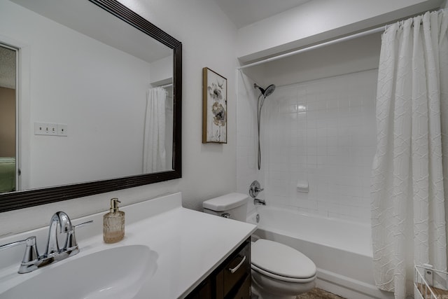 full bathroom with vanity, shower / bath combination with curtain, and toilet