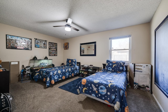 bedroom featuring ceiling fan, carpet, and a textured ceiling