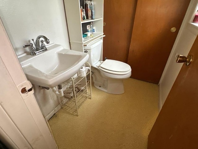 bathroom featuring toilet