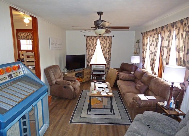 living room featuring dark hardwood / wood-style floors and ceiling fan