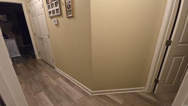 hallway with wood-type flooring