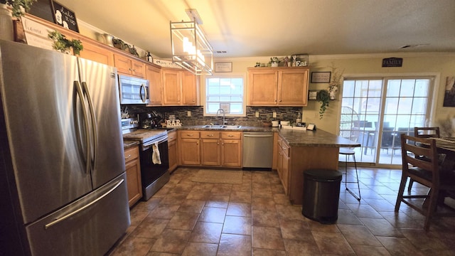 kitchen featuring sink, appliances with stainless steel finishes, tasteful backsplash, decorative light fixtures, and kitchen peninsula