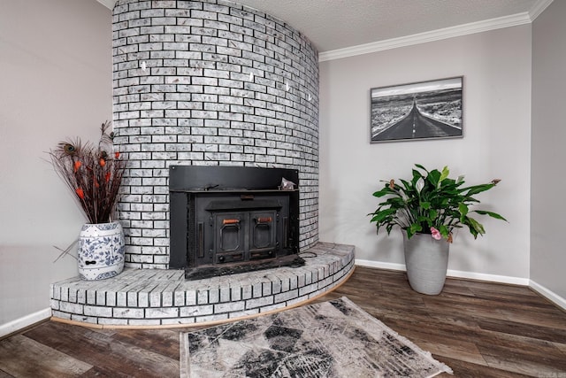 interior details with hardwood / wood-style floors, crown molding, and a textured ceiling