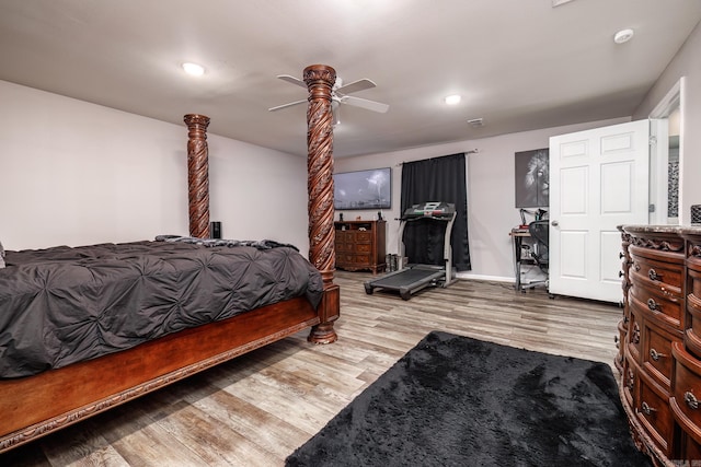 bedroom with light hardwood / wood-style flooring and ceiling fan