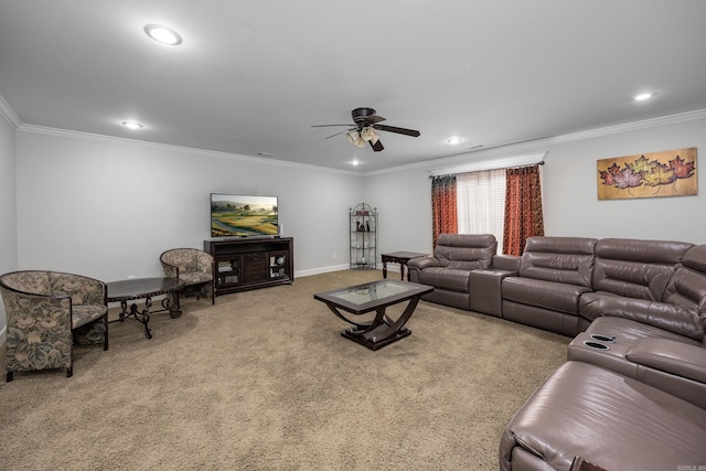 living room with ceiling fan, ornamental molding, and carpet