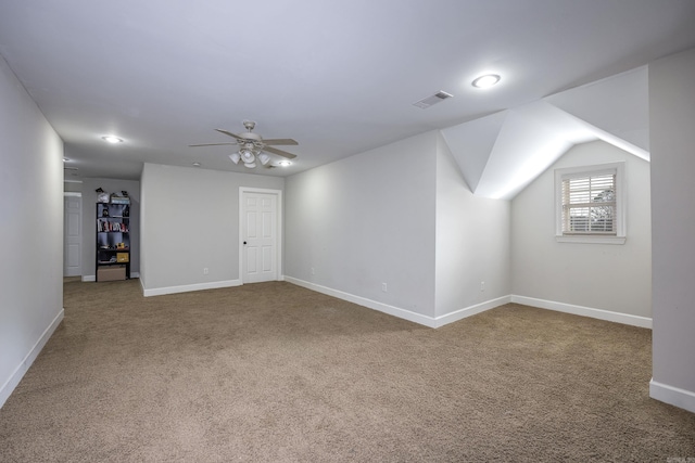 interior space with carpet flooring and ceiling fan