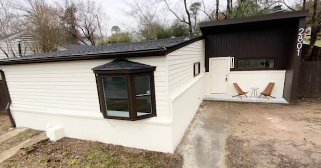 view of property exterior with a patio