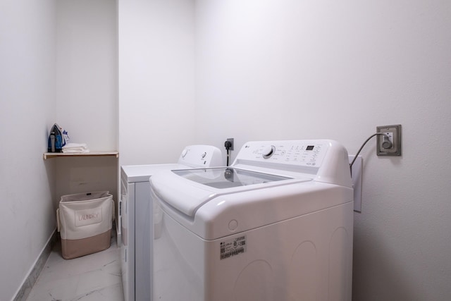 washroom with washer and dryer