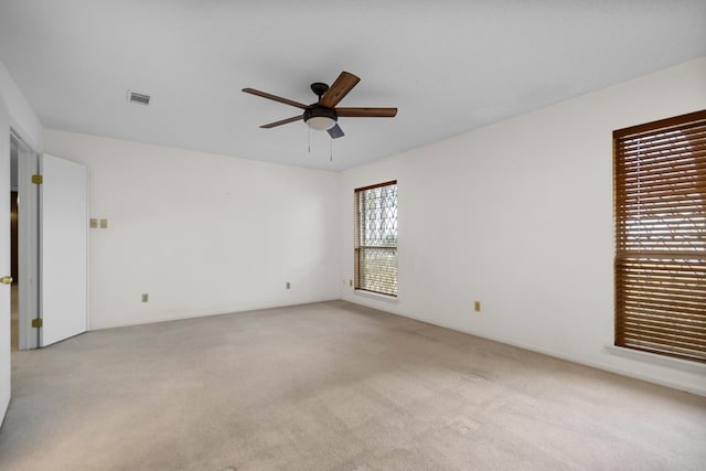 carpeted empty room with ceiling fan