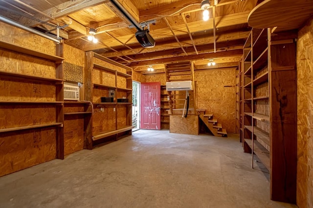 garage featuring a wall mounted air conditioner