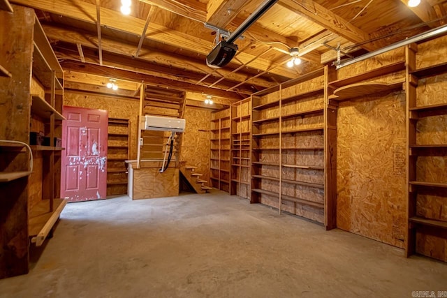 interior space featuring a wall mounted air conditioner and concrete flooring