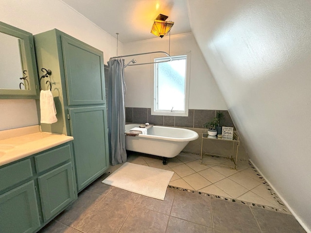 bathroom featuring vanity, separate shower and tub, and tile patterned floors