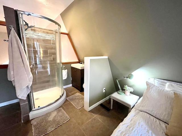 bathroom featuring vanity, tile patterned floors, and walk in shower