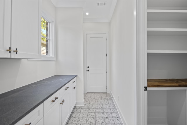 interior space featuring recessed lighting, baseboards, visible vents, and light floors