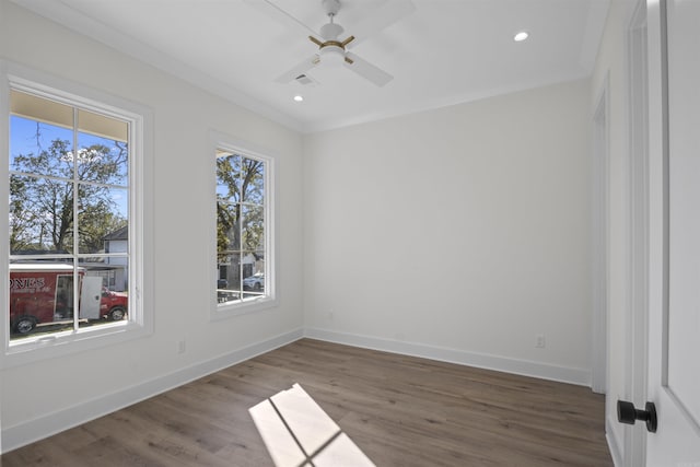 spare room featuring recessed lighting, wood finished floors, visible vents, and baseboards