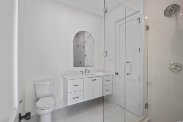 bathroom with toilet, a stall shower, and vanity