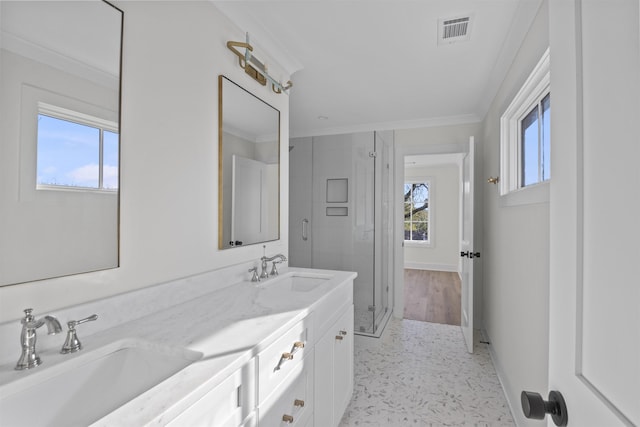 full bath with visible vents, a sink, and ornamental molding