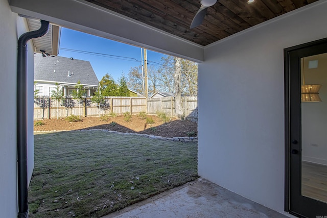 view of yard featuring ceiling fan, a patio area, and fence