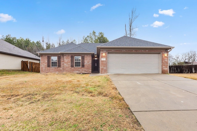 ranch-style house with a garage and a front lawn