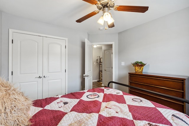 bedroom with ceiling fan and a closet