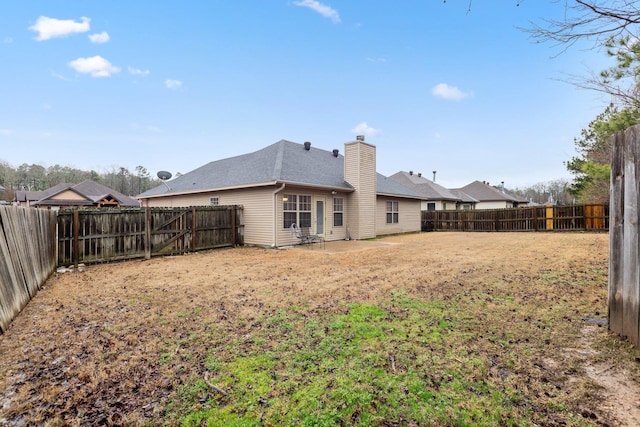 rear view of property featuring a patio