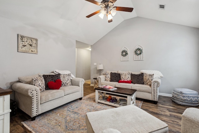 living room with dark wood-type flooring, ceiling fan, and vaulted ceiling