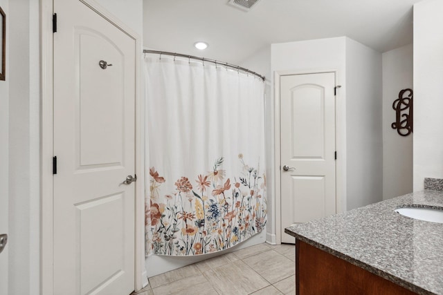 bathroom with vanity and tile patterned floors