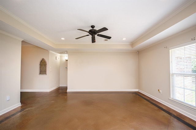 unfurnished room with ceiling fan, ornamental molding, and a tray ceiling