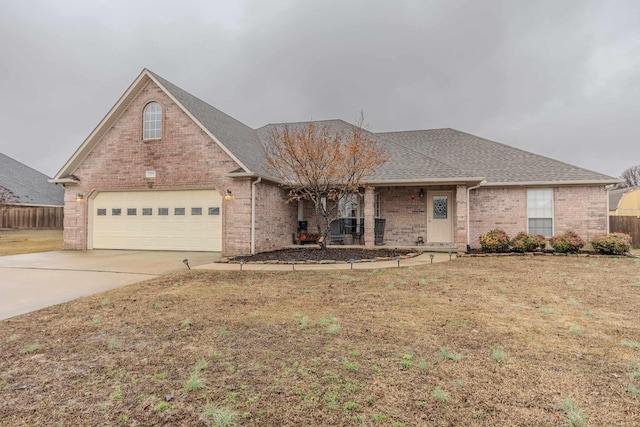 view of front facade featuring a garage and a front lawn