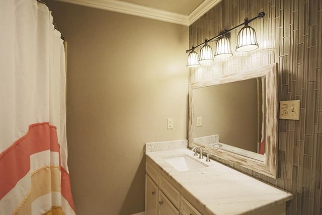 bathroom featuring ornamental molding and vanity