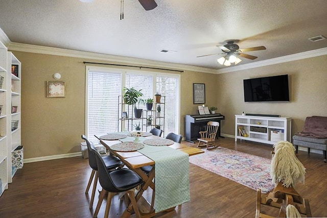 dining area featuring dark hardwood / wood-style flooring, ornamental molding, and a textured ceiling