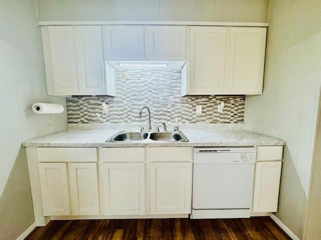 kitchen featuring sink, white cabinets, white dishwasher, and decorative backsplash