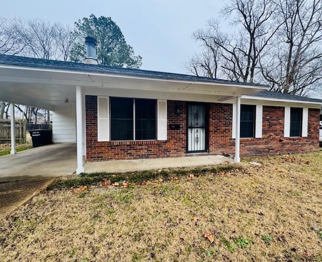 single story home with a carport and a front yard