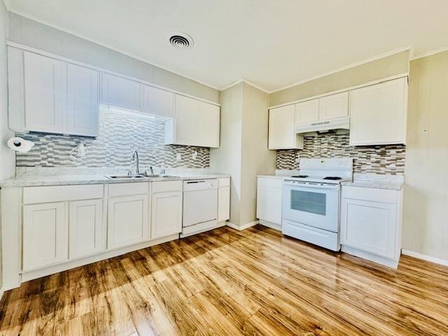 kitchen featuring sink, white cabinetry, white appliances, light hardwood / wood-style floors, and decorative backsplash