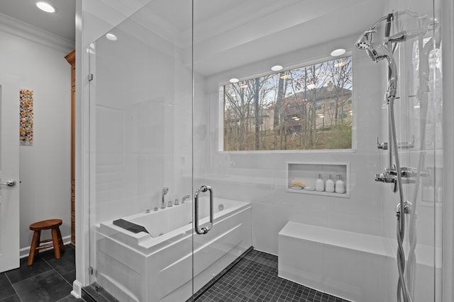 bathroom featuring tile patterned flooring, a bathtub, and ornamental molding