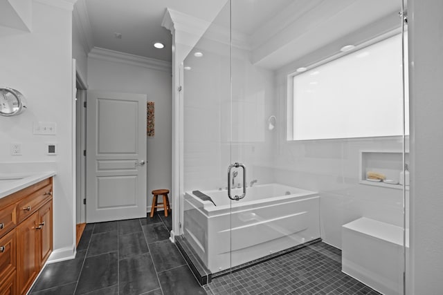 bathroom featuring crown molding, vanity, a bathing tub, and tile patterned flooring