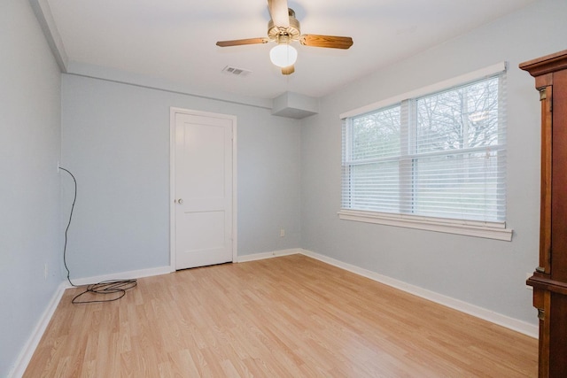 spare room featuring ceiling fan and light hardwood / wood-style flooring