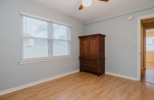 unfurnished bedroom with ceiling fan and light hardwood / wood-style floors