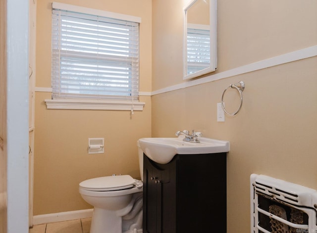 bathroom featuring vanity, toilet, and tile patterned flooring