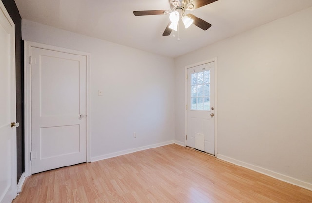 empty room featuring light hardwood / wood-style flooring and ceiling fan