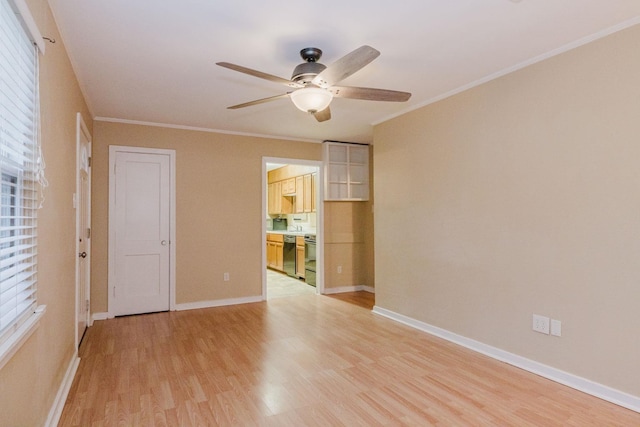 empty room with ceiling fan, ornamental molding, and light wood-type flooring